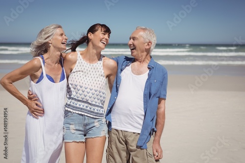 Cheerful family standing at beach