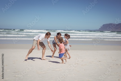 Happy family playing at beach