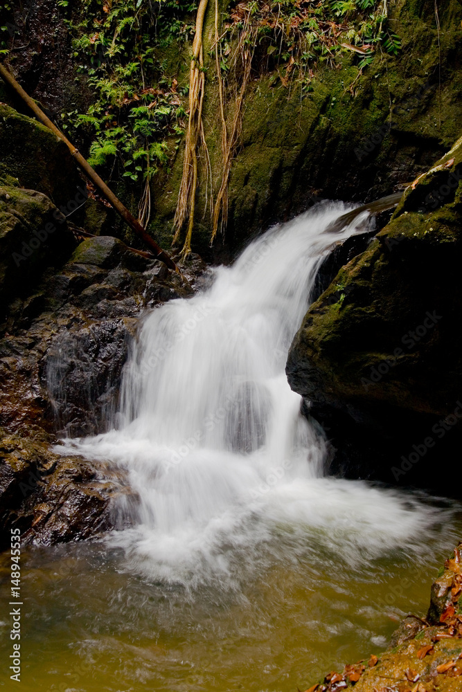 Beautiful Thai natural waterfall in a rocky gorge. Beautiful Thai natural waterfall in a rocky gorge.