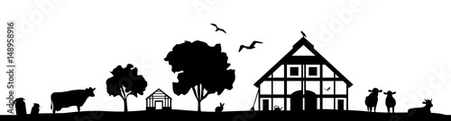 Silhouette Haus und Kühe