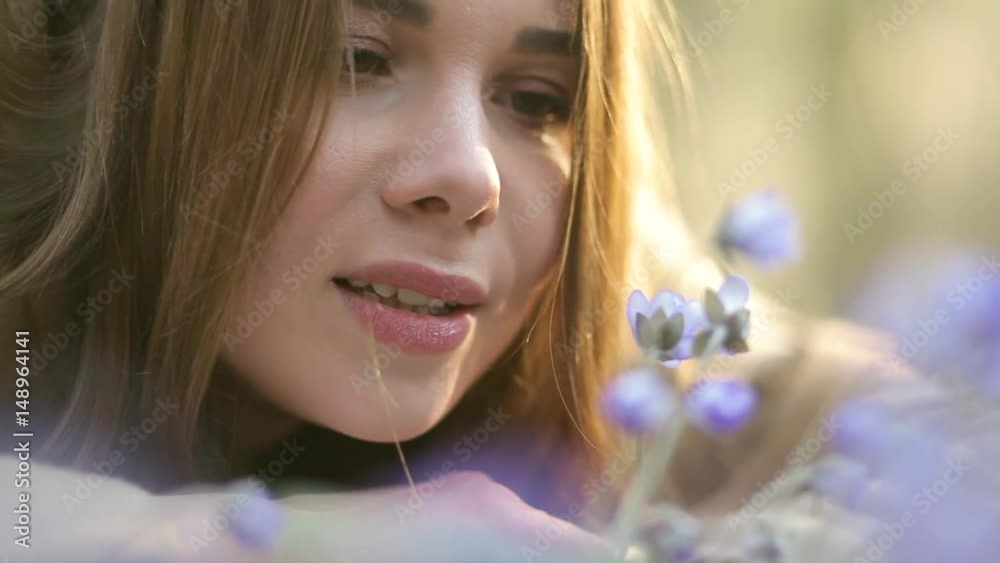 The girl in the Park admiring the snowdrops The girl in the Park admiring the snowdrops