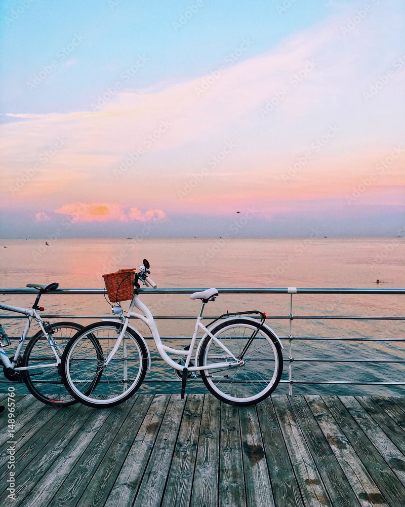 Fototapeta premium vintage bicycle on beach over blue sea and clear blue sky background, spring or summer holiday vacation concept.
