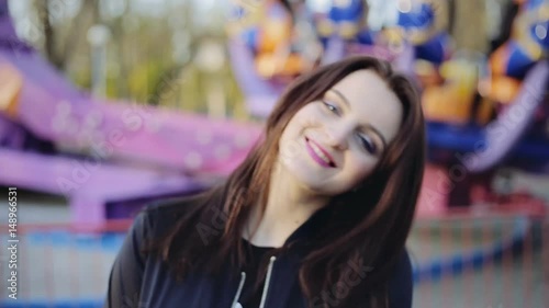 Wallpaper Mural Young attractive cheerful woman posing in amusement park at sunset Torontodigital.ca