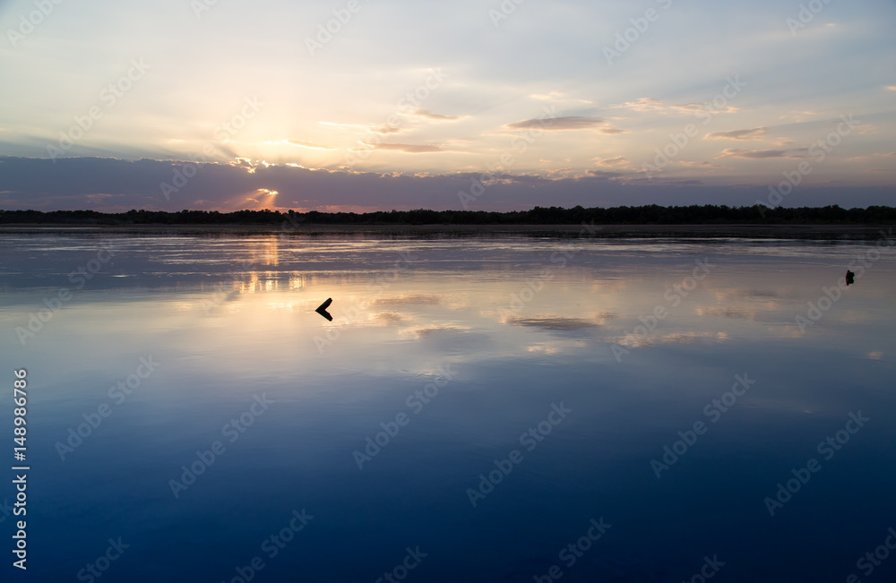 Fototapeta premium sunset on the lake as a backdrop