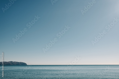 View of ocean against clear sky photo