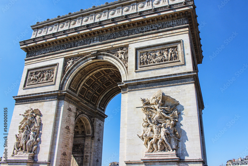 View on Triumphal arch, front view, blue sky, paris city, france View on Triumphal arch, front view, blue sky, paris city, france