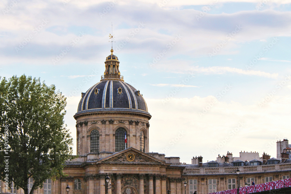 View on Institute of France building, blue sky with white clouds, paris city, france