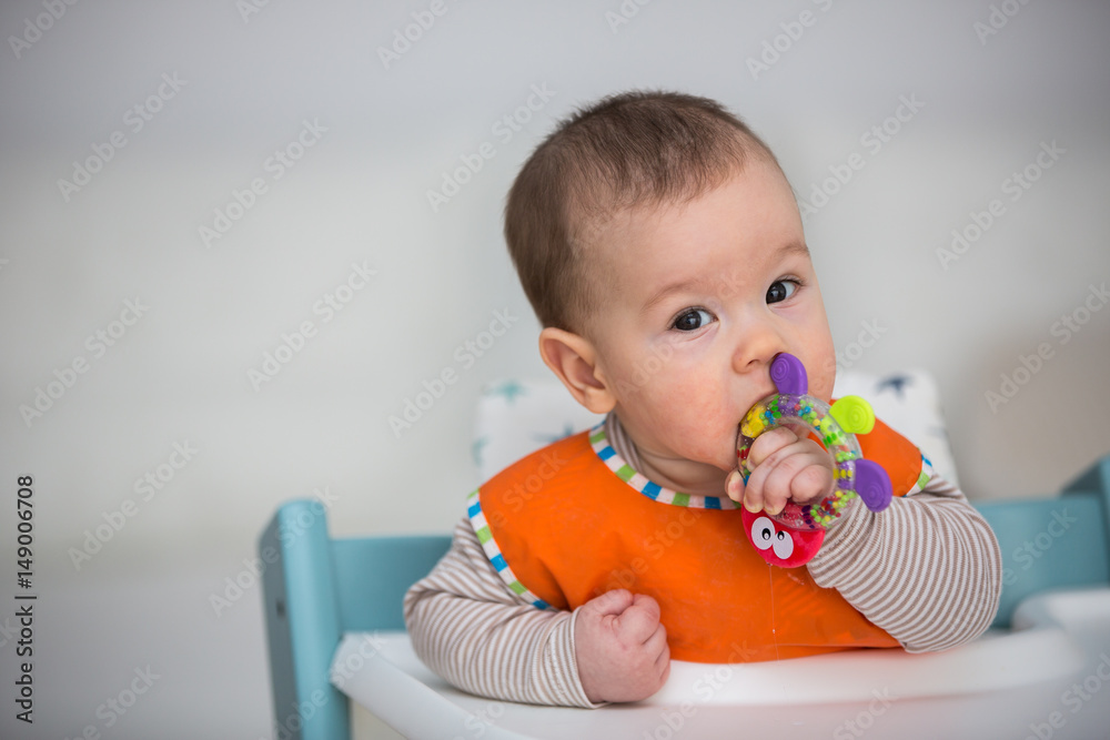Baby laughing during lunch time. (6 months old). Baby laughing during lunch time. (6 months old).