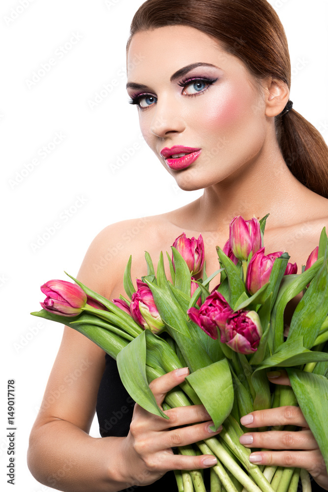 Beautiful woman with tulips on a white background Beautiful woman with tulips on a white background