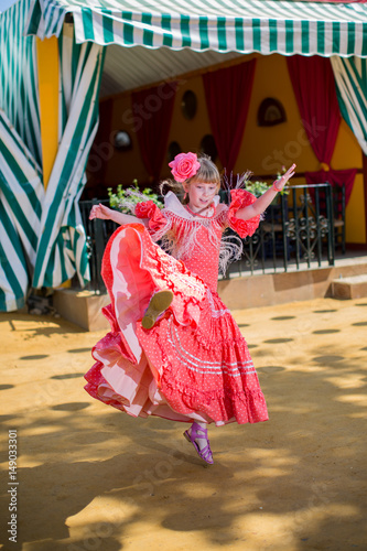 Little girls in flamenco style dress at the Sevilla, Spain. Seville's April Fair on April