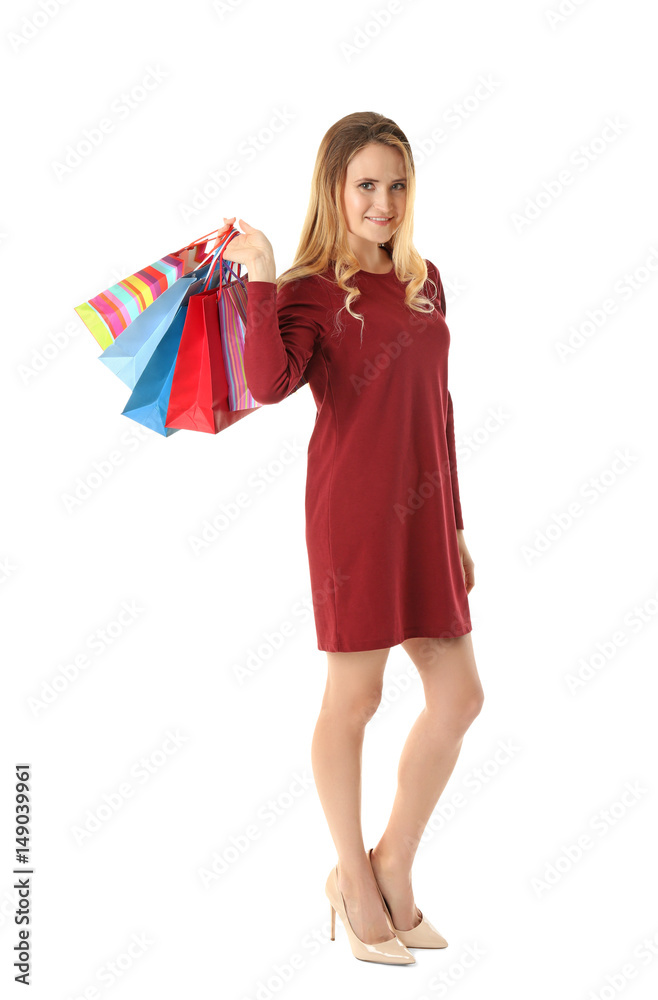 Beautiful woman with paper bags on white background
