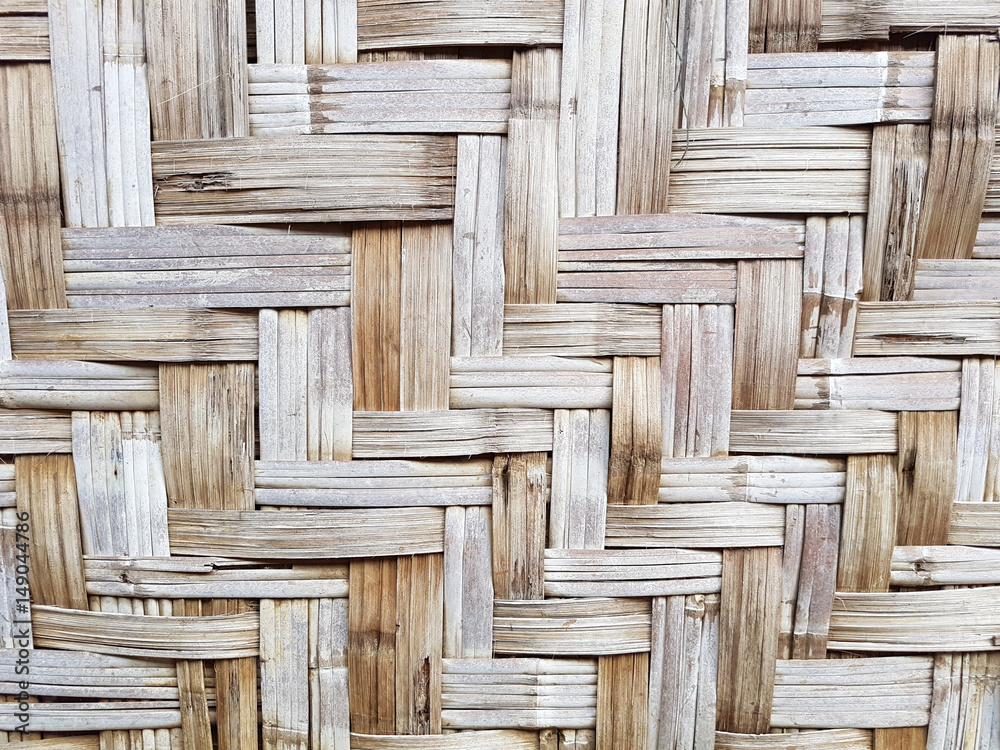 pattern of old Thai house wall for background and texture. Made of bamboo plant stalks pattern of old Thai house wall for background and texture. Made of bamboo plant stalks