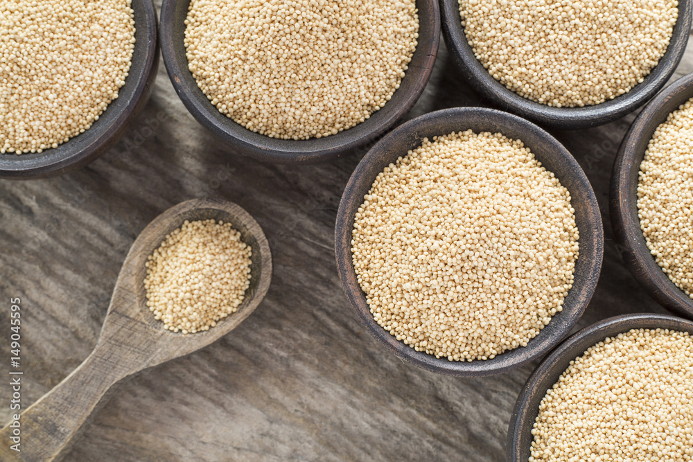 Amaranthus seeds on the wooden table - Amaranthus Amaranthus seeds on the wooden table - Amaranthus