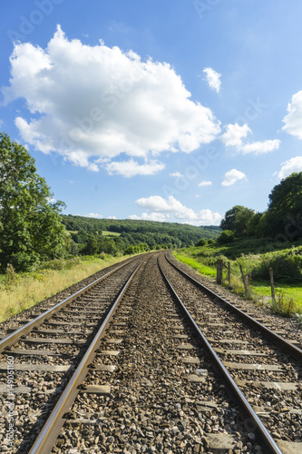 Railway tracks passing through English countryside.