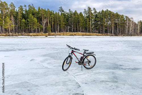 Bike on the ice of the Ob reservoir