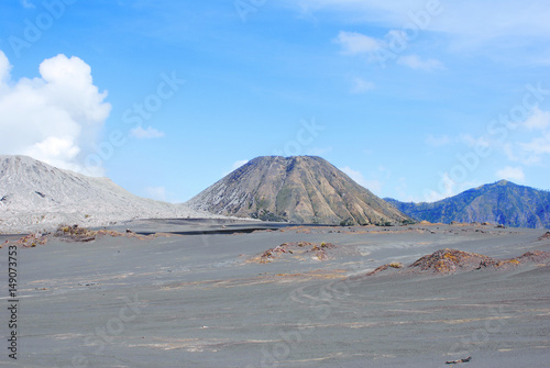 Brown sandy foot of the active Volcano mount Bromo early in the morning at the Tengger Semeru National Park in East Java, Indonesia.