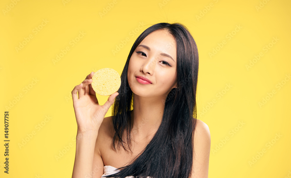 young woman with delicate skin dolzhiti in hand sponge... young woman with delicate skin dolzhiti in hand sponge...