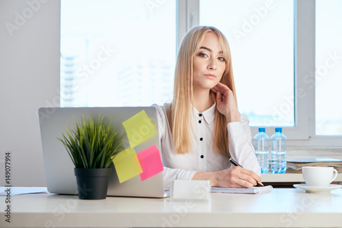 beautiful blonde, business lady with laptop, office, flower