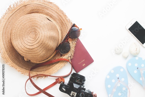 Flat lay of summer items and passport  Travel concept on white background with copy space