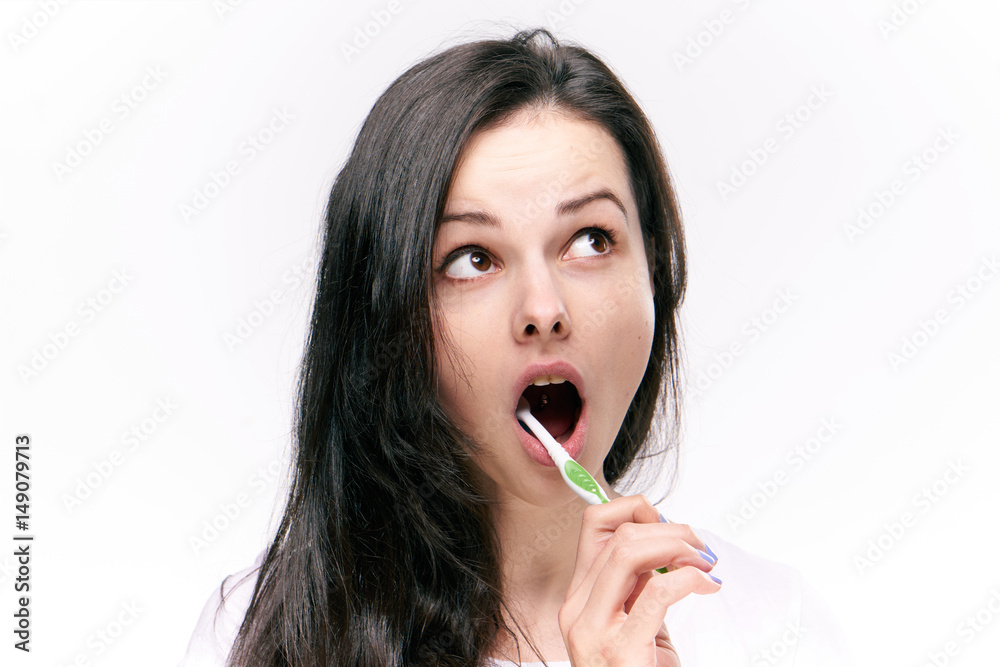woman with a toothbrush in her mouth woman with a toothbrush in her mouth