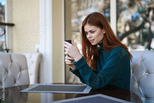 woman with telephone  table  cafe