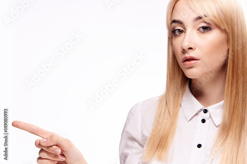 young woman in a light shirt, blonde...