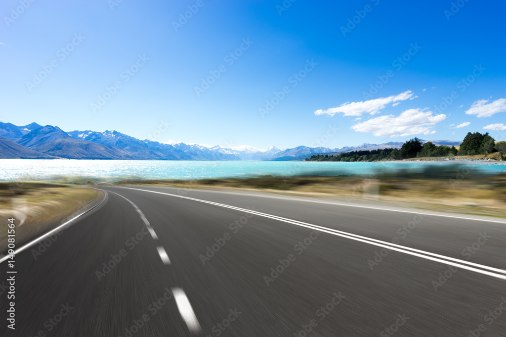 Naklejka premium empty road with blue sea in blue sky