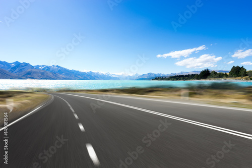 empty road with blue sea in blue sky