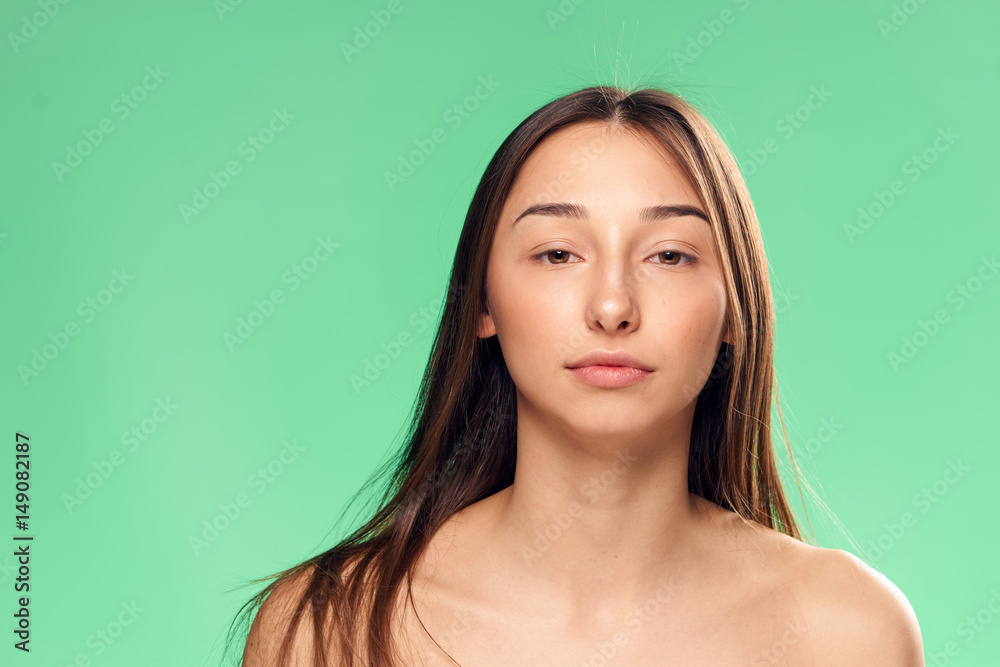 beautiful woman on a green background, long hair beautiful woman on a green background, long hair