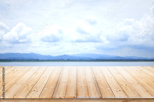 Wood plank with lake blurred background for product display
