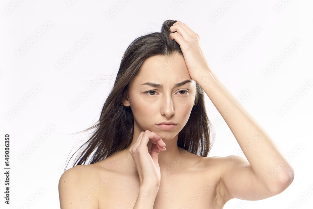 thoughtfulness, anxiety, woman touches her hair thoughtfulness, anxiety, woman touches her hair
