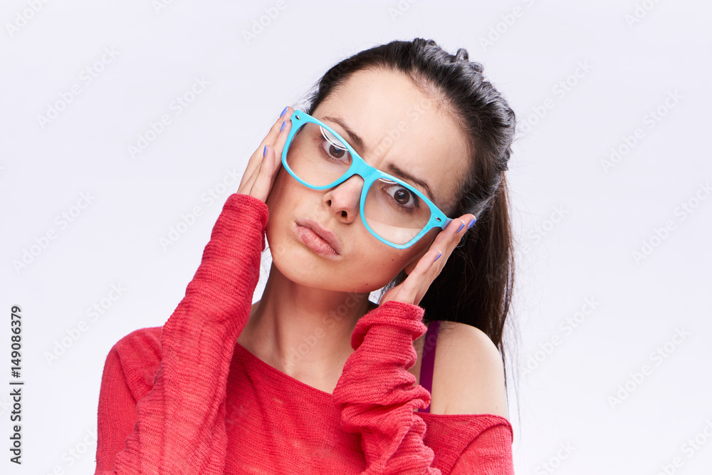 woman in blue glasses and in a red jacket