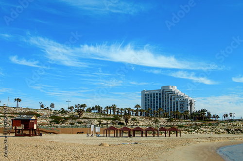 Fototapeta Naklejka Na Ścianę i Meble -  Ashkelon summery coastline with palm trees