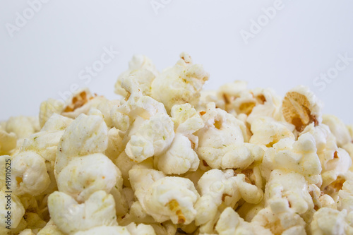 Popcorn in white bowl closeup image white background