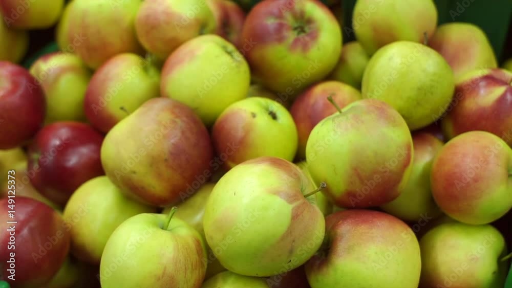 Bunch of green and red apples in boxes in supermarket. Bunch of green and red apples in boxes in supermarket.