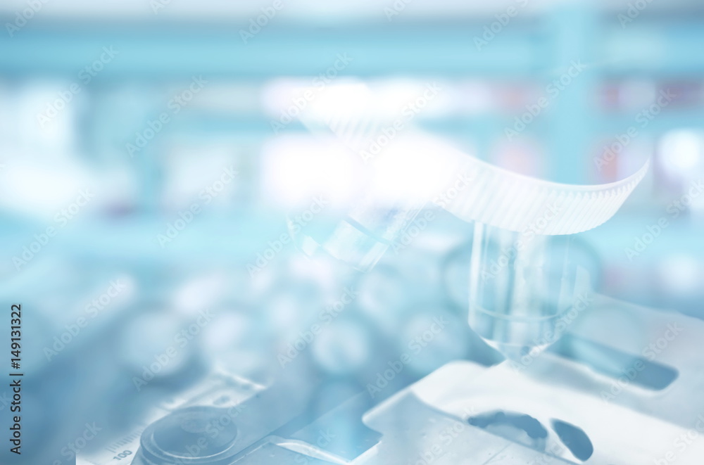 microscope and test tube in laboratory background microscope and test tube in laboratory background
