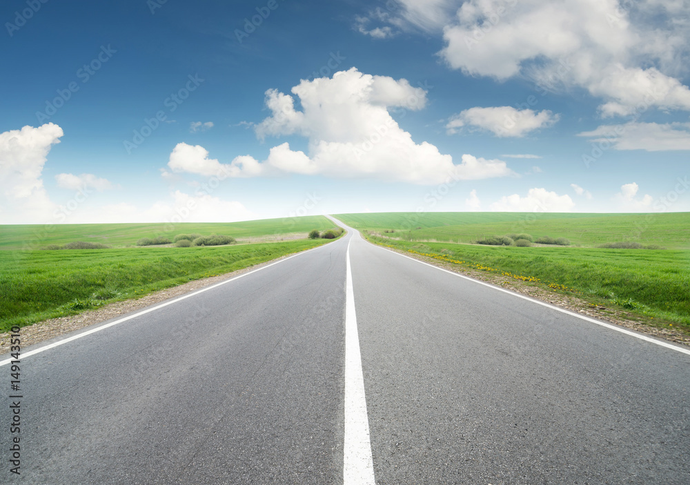 Road and cloudy sky. Beautiful natural concept and idea of travel