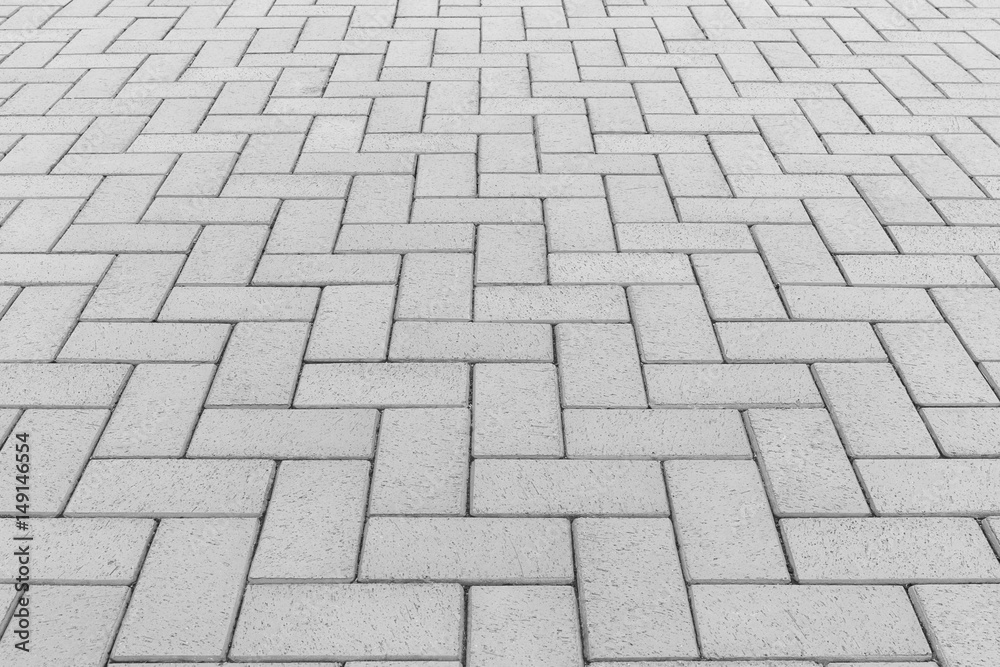 Paver brick floor also call brick paving, paving stone or block paving. Manufactured from concrete or stone for road, path, driveway and patio. Empty floor in perspective view for texture background. Paver brick floor also call brick paving, paving stone or block paving. Manufactured from concrete or stone for road, path, driveway and patio. Empty floor in perspective view for texture background.