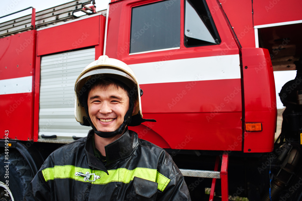 Naklejka premium Portrait of a man, a firefighter, an Asian-Kazakh at work