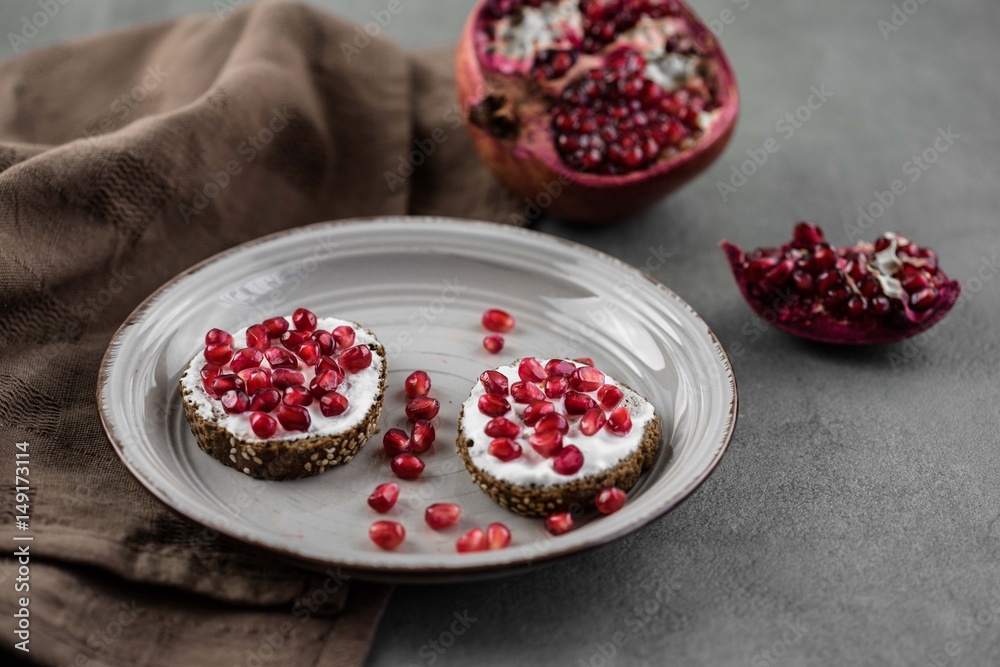 bread with cream cheese and pomegranate seeds.bread with cream cheese and pomegranate seeds. bread with cream cheese and pomegranate seeds.bread with cream cheese and pomegranate seeds.