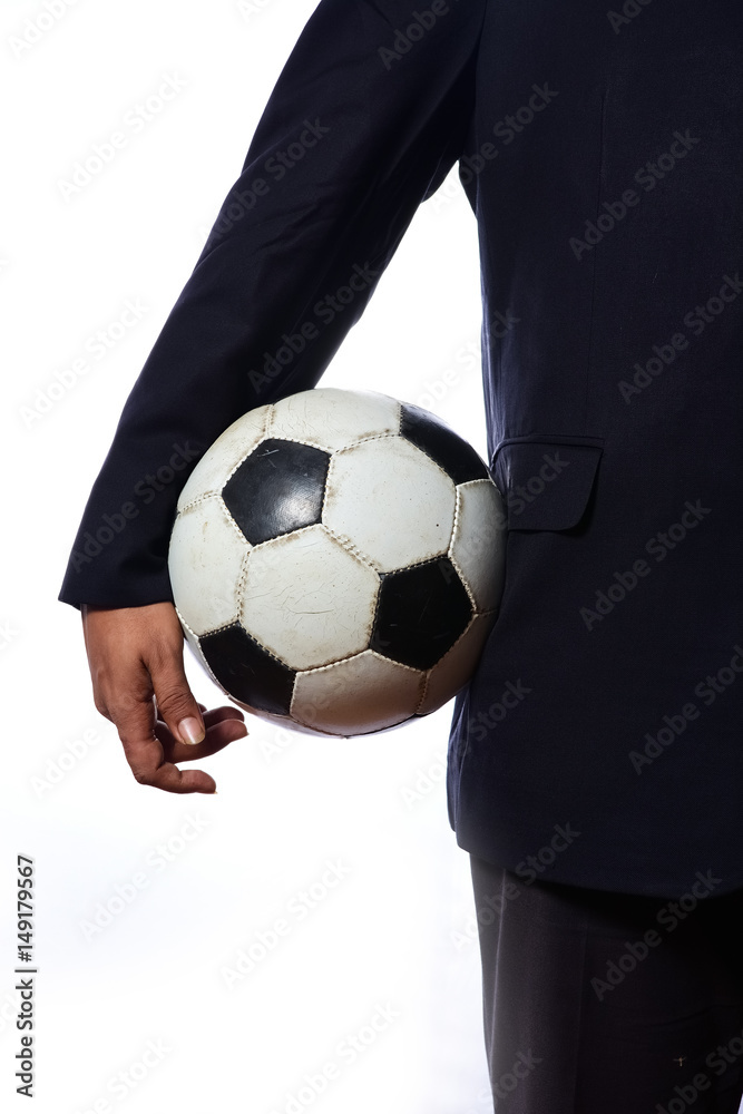 Businessman holding football ball Businessman holding football ball