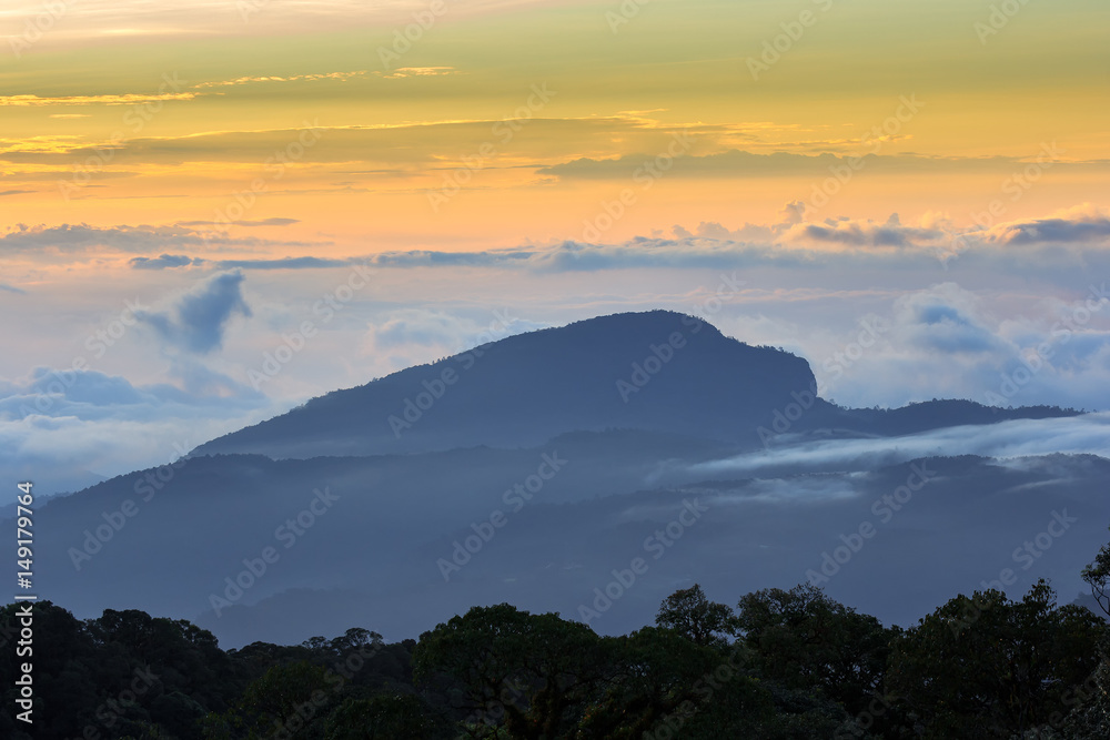 Beautiful Colorful Sunrise and Silhouette Mountain on the top of mountain in Thailand 
