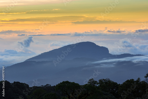 Beautiful Colorful Sunrise and Silhouette Mountain on the top of mountain in Thailand 