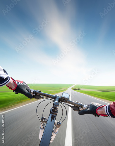 Ride on bycycle on road. Sport and active life concept © biletskiyevgeniy.com