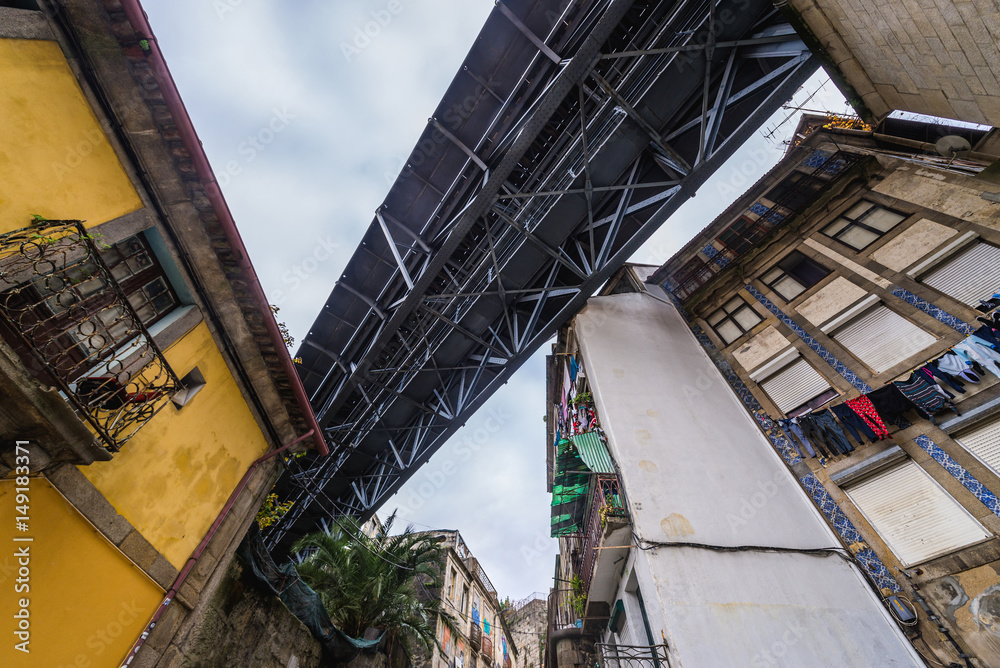 Old houses under the steel bridge of Dom Luis I in Porto, Portugal