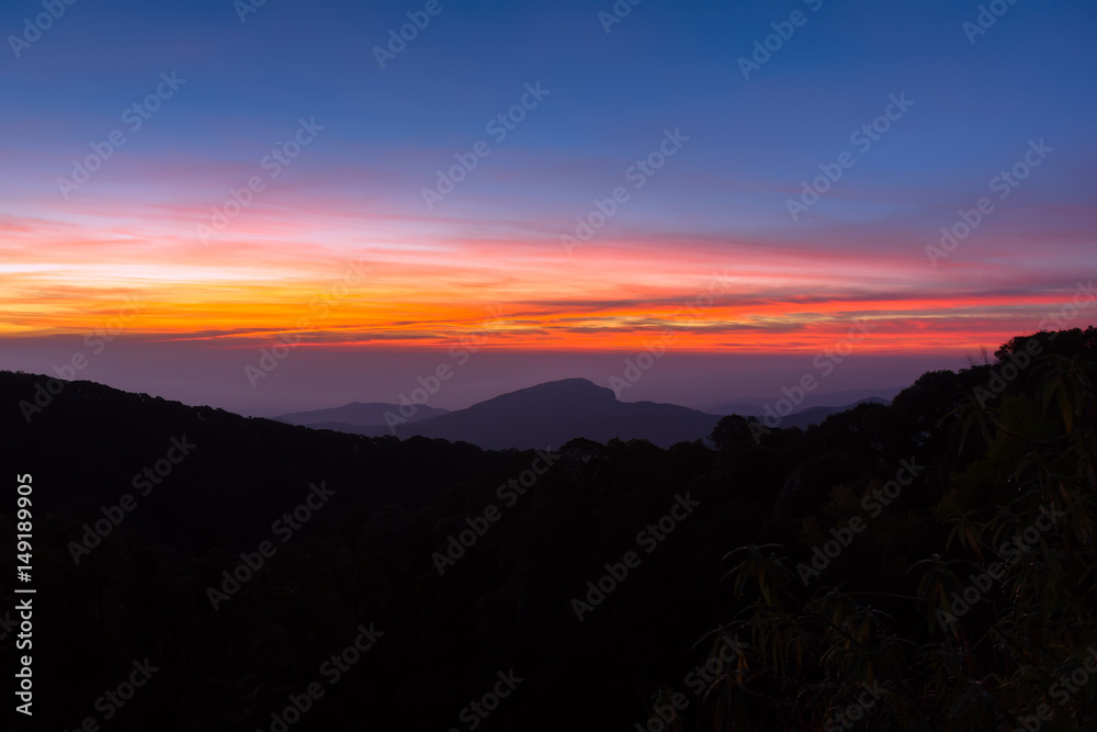 Beautiful Colorful Sunrise and Silhouette Mountain on the top of mountain in Thailand 
