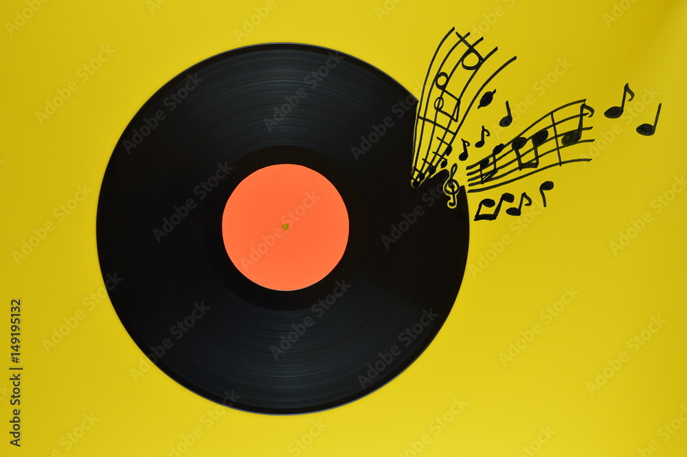 old black vinyl record with blank orange label centered on yellow background with notes and staves coming from it old black vinyl record with blank orange label centered on yellow background with notes and staves coming from it