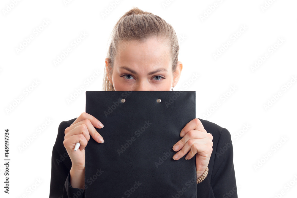 young beautiful girl covers her face and looks into the Tablet Chamber isolated on white background young beautiful girl covers her face and looks into the Tablet Chamber isolated on white background