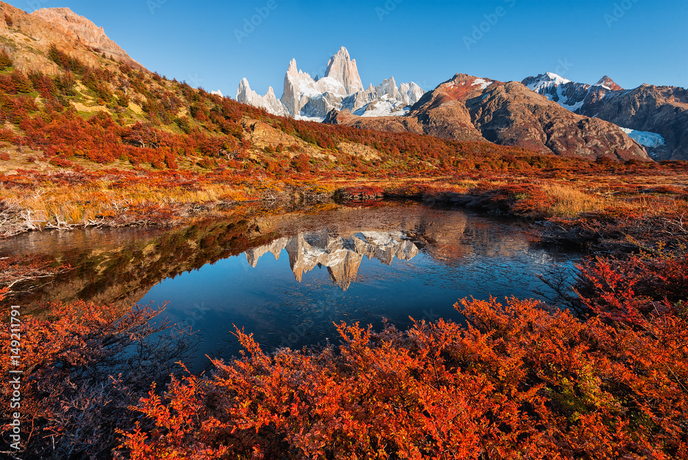 The autumn reflection of the Monte Fitz Roy (Cerro Chalte) - the peak located in Patagonia in the border area between Argentina and Chile, the view from the trail in the National Park of Los Glaciares