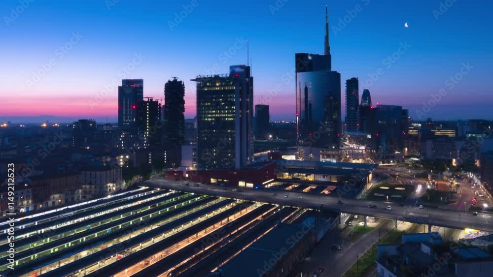 city of milan skyline time lapse from night to day pan